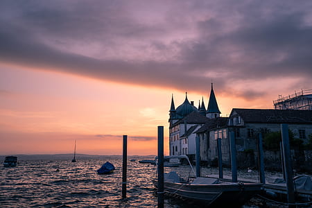 black and red boat on dock taken at sunset thumbnail
