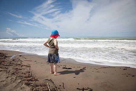 boy standing in front of seawater thumbnail