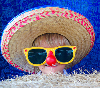 child wearing brown sombrero and yellow sunglasses thumbnail