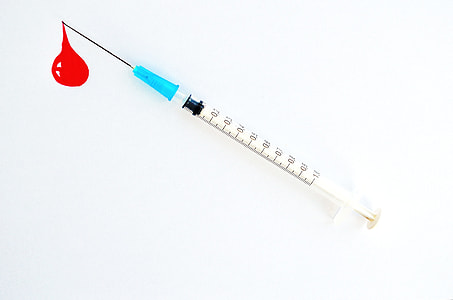 white and black plastic syringe thumbnail