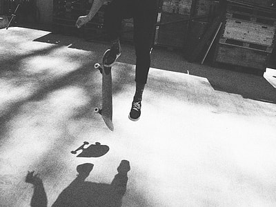 greyscale photo of person playing skateboard thumbnail