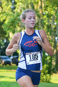 woman running near tree thumbnail