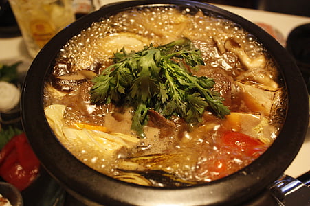black ceramic bowl with soup thumbnail