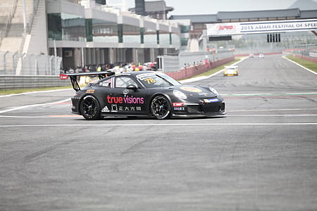 black Porsche coupe thumbnail