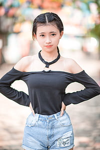 girl standing and holding her hips thumbnail