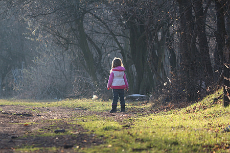 toddler standing beside the trees thumbnail