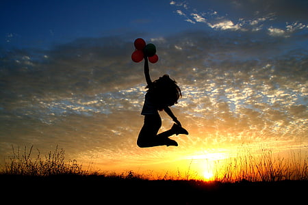 photo of woman jumping on air during golden hour thumbnail