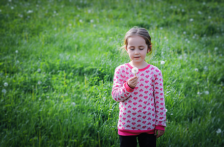 girls standing on green grass field during daytime thumbnail