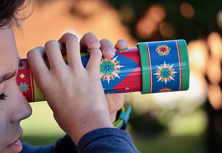 boy holding red and blue scope toy thumbnail