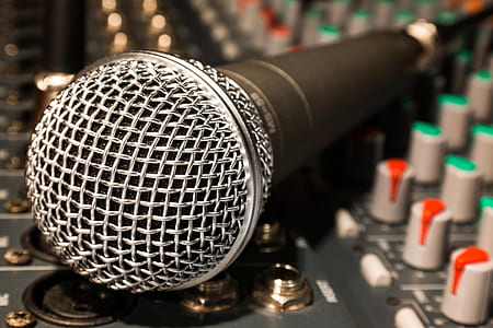 black and gray corded microphone on audio mixer thumbnail