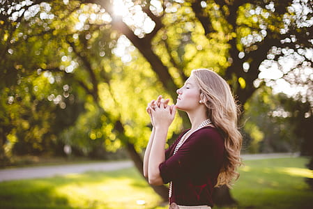 woman in maroon top posing for photo thumbnail