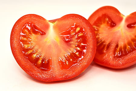 sliced red tomato on white surface thumbnail