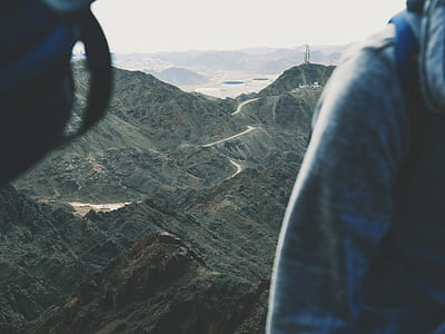 selective focus photo of river in between of mountains thumbnail