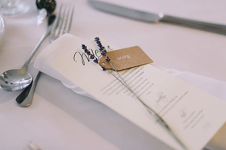 stainless steel spoon and fork on white table thumbnail