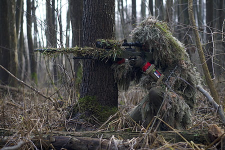 person using green hunting rifle gun thumbnail