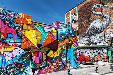 Vibrantly-coloured street art and graffiti near Brick Lane in London thumbnail