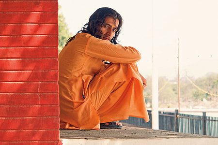 man in orange long-sleeved traditional dress thumbnail