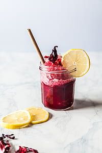 fruit drink with lemon slice and cinnamon stick thumbnail