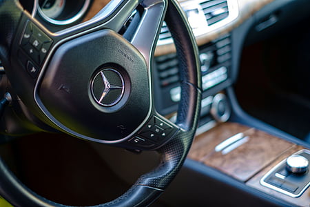 black Mercedes-Benz multifunction steering wheel thumbnail