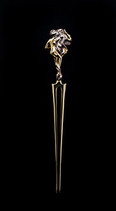 gold-colored handheld accessory thumbnail