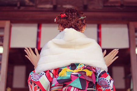 woman wearing pink and white floral shirt with white scarf thumbnail
