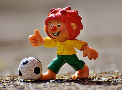 boy playing soccer figurine thumbnail