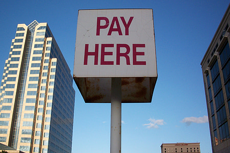 Pay Here road sign post thumbnail