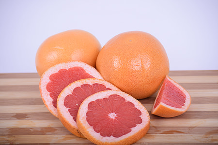 sliced orange citrus on brown wooden chopping board thumbnail