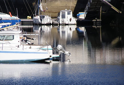 dock motorized boats on sea taken during daytime thumbnail