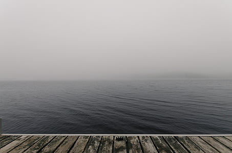 wooden dock through sea thumbnail