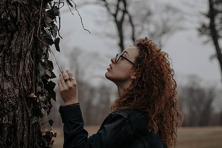 woman looking at tree at daytime thumbnail