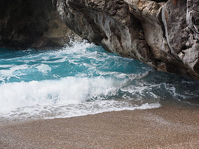 body of water beside rock thumbnail