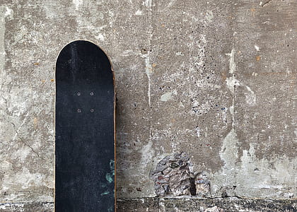 black skateboard on concrete thumbnail