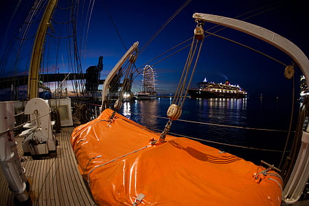gray metal boat pulleys taken during night time thumbnail