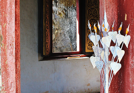 grey metal decor beside opened window at daytime thumbnail