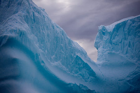 glacier mountain under gray clouds at daytime thumbnail