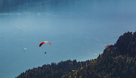 two person paragliding during daytime thumbnail