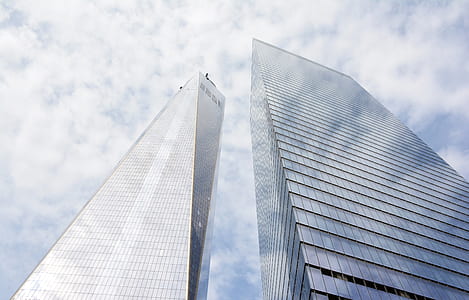 low angle photography of two curtain window buildings thumbnail