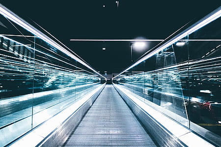 time lapse photography of moving walkway thumbnail