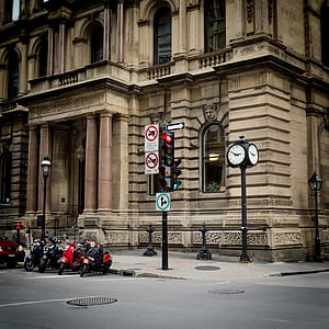 brown concrete building with motorcycles in front thumbnail