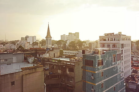 gray and white concrete building at golden hour thumbnail