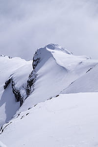 rocks covered with snow photography thumbnail