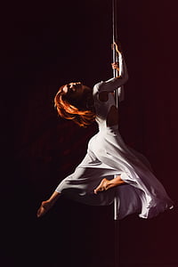 time-lapse photography of female pole dancer thumbnail