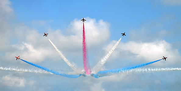 airplane show living colored smoke trail at daytime thumbnail