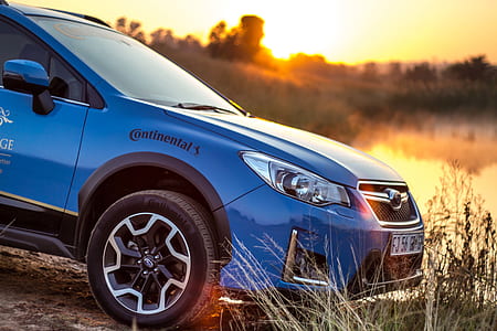 blue Subaru car parked thumbnail