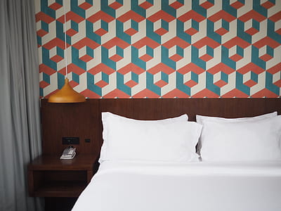 white bedspread with geometric pattern wall paint thumbnail
