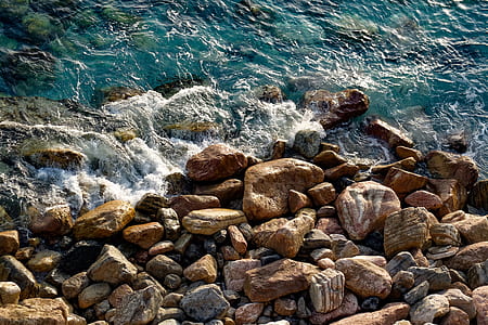 brown stones and body of water thumbnail