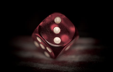 red dice in shallow focus lens photography thumbnail