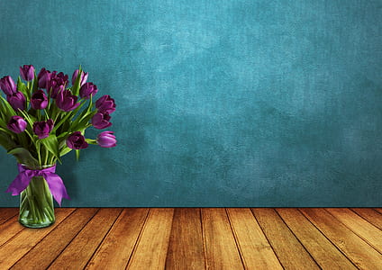 purple tulips on clear glass vase thumbnail