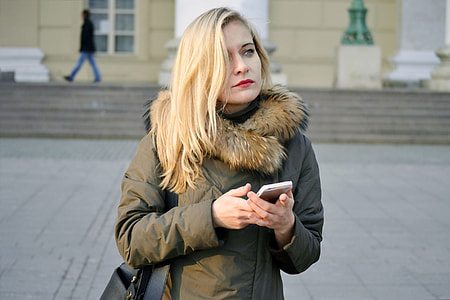 woman holding smartphone thumbnail